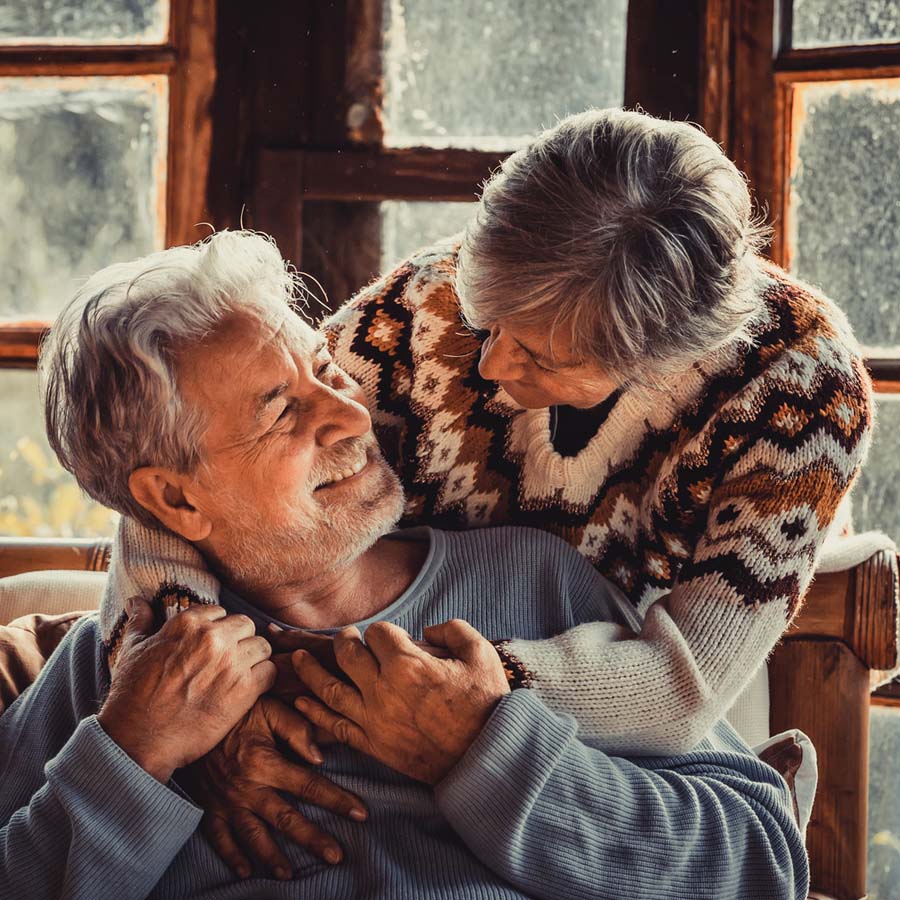 Elderly couple embracing