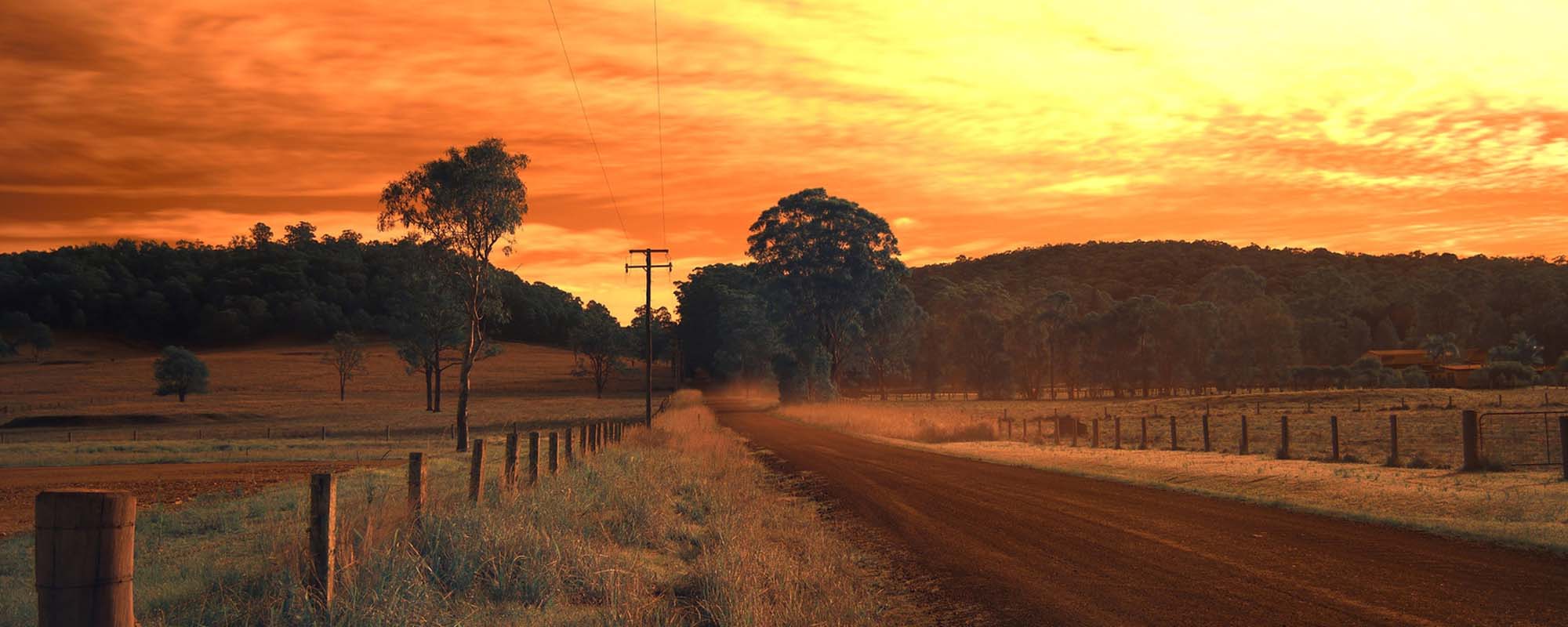Dirt road at sunset