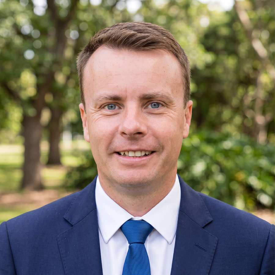 Paul in blue tie headshot